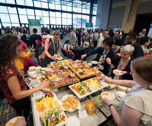 People eating at the opening mixer