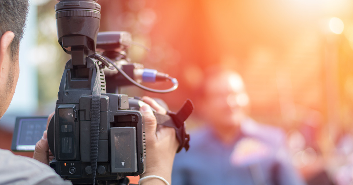 reporter and cameraman in the field