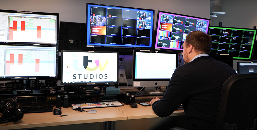 man in ITV Studios at edit station