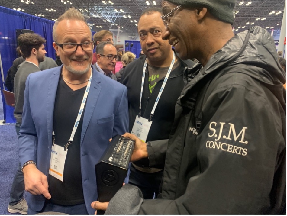 MBOX Studio audio interface being held at AES 2022 in NYC