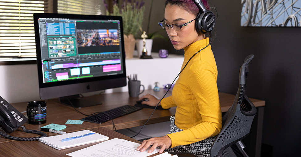 Man using Avid |Edit on Demand solution as part of post production process