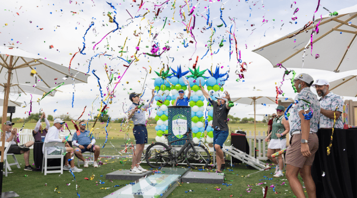 Banner Children's Open Challenge Hole winners confetti. 