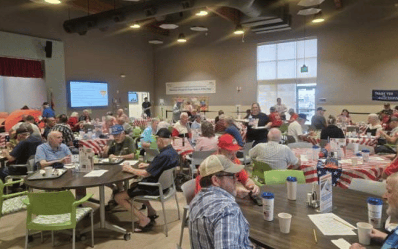 Veterans meeting up for coffee in a cafeteria. 