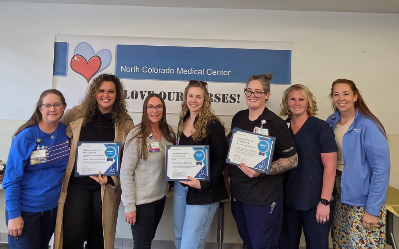 North Colorado Medical Center staff holding certificates with a banner that says 
