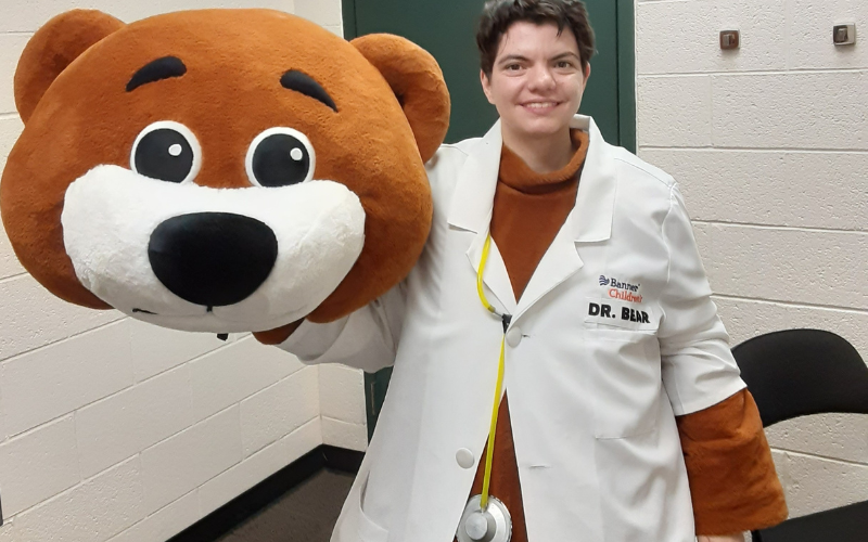 A person in a white lab coat with 