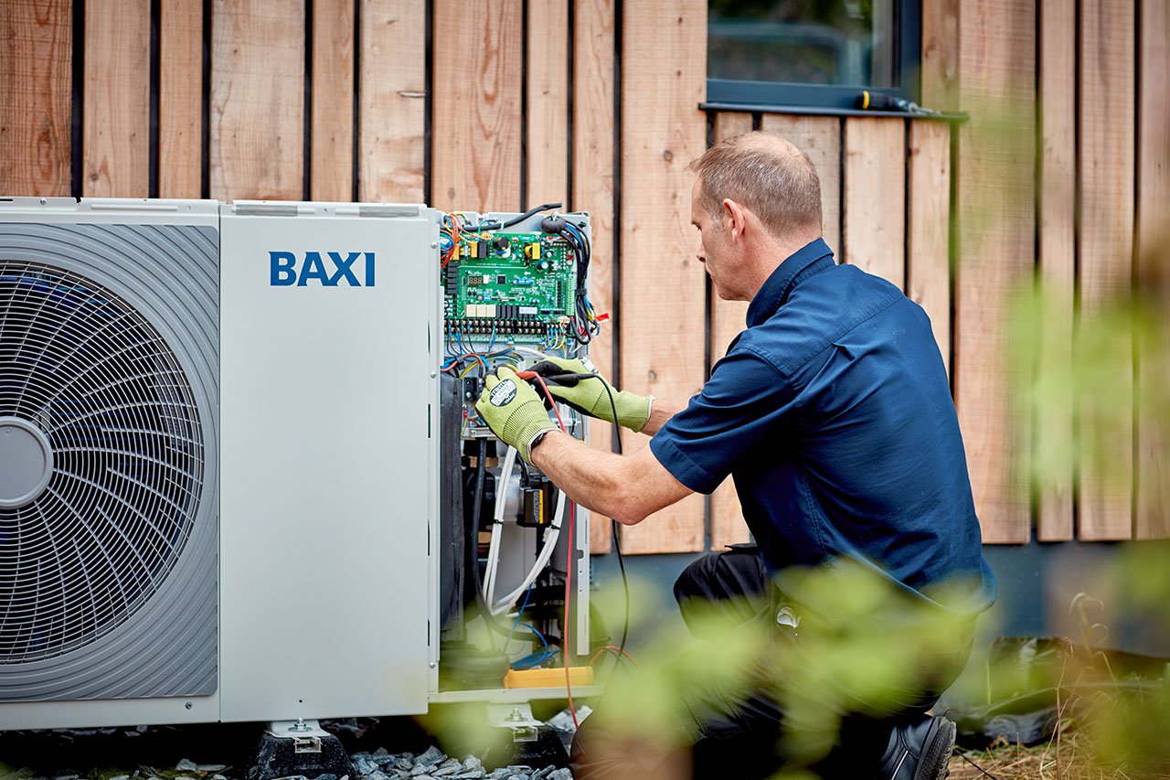 Engineer installing the Baxi Air Source Heat Pump