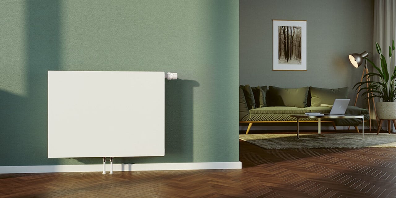 Flachheizkörper von BRÖTJE vor einer grünen Wand