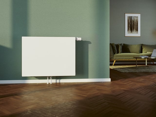 Flachheizkörper von BRÖTJE vor einer grünen Wand