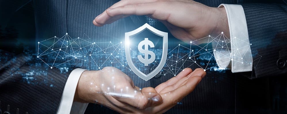 Businessman confidently holds a shield emblazoned with a dollar sign, symbolizing financial protection and security.