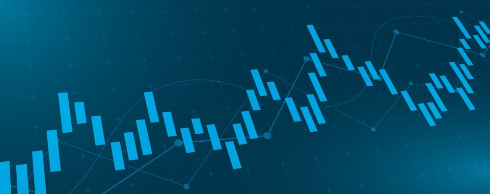Blue financial chart with candlestick patterns and line graphs on a dark grid background, depicting fluctuating market trends and data analysis.