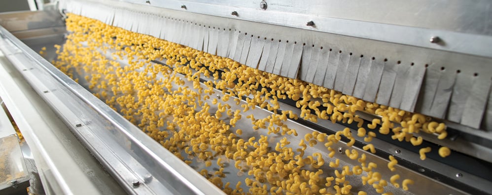 Factory machine with noodles falling