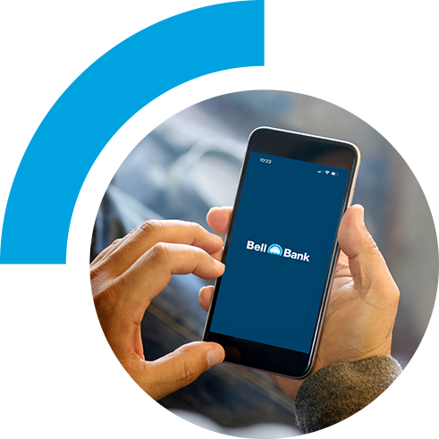 Person holding phone that is displaying Bell Bank logo
