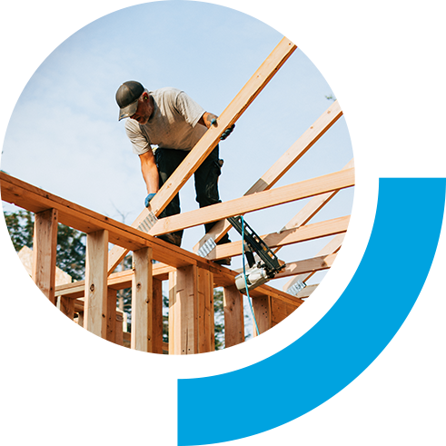 Construction worker working on the frame of a house