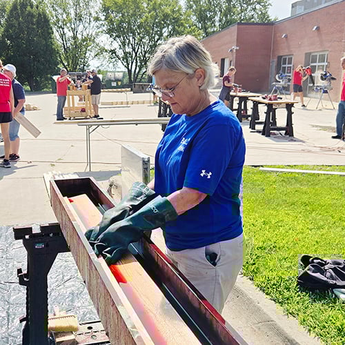 Pay It Forward Story - Building Dreams_Mary Voss volunteering