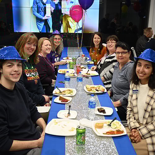 Bell employees eating lunch at table