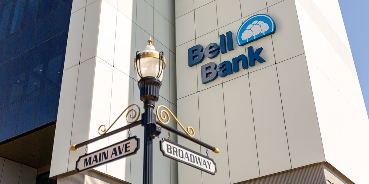 Exterior shot of Bell Bank Tower Headquarters where the Bell Bank logo is shown in addition to a street post of "Main Ave" and "Broadway".