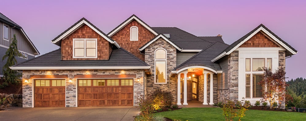 Exterior view of a home with lights on