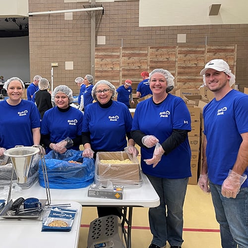 Bell Bank group photo working at Feed My Starving Children