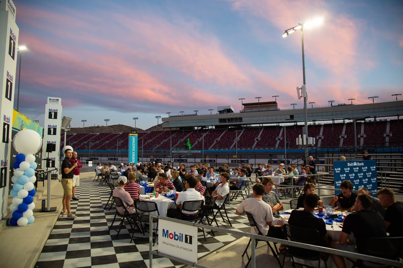 Pay It Forward Collegiate Tournament Speaker Talking to Players