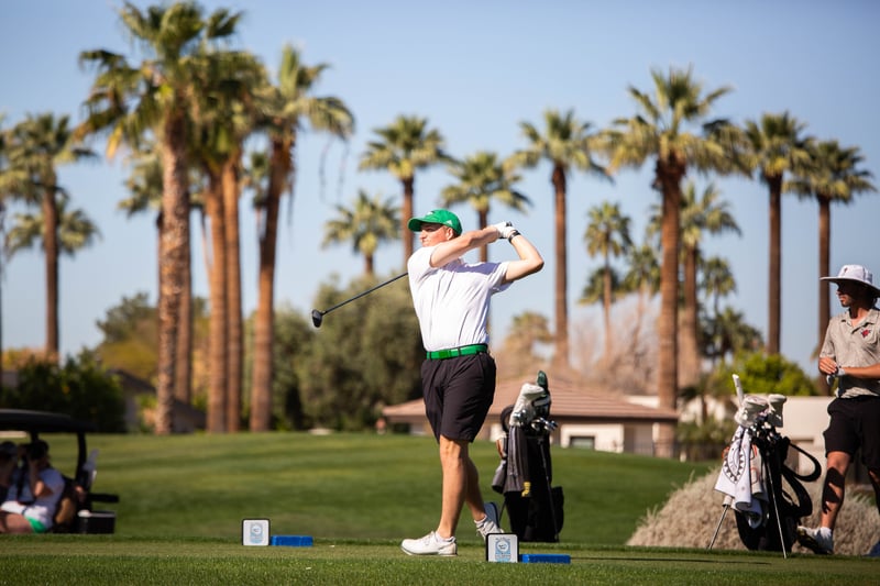 Pay It Forward Collegiate player swinging golf club