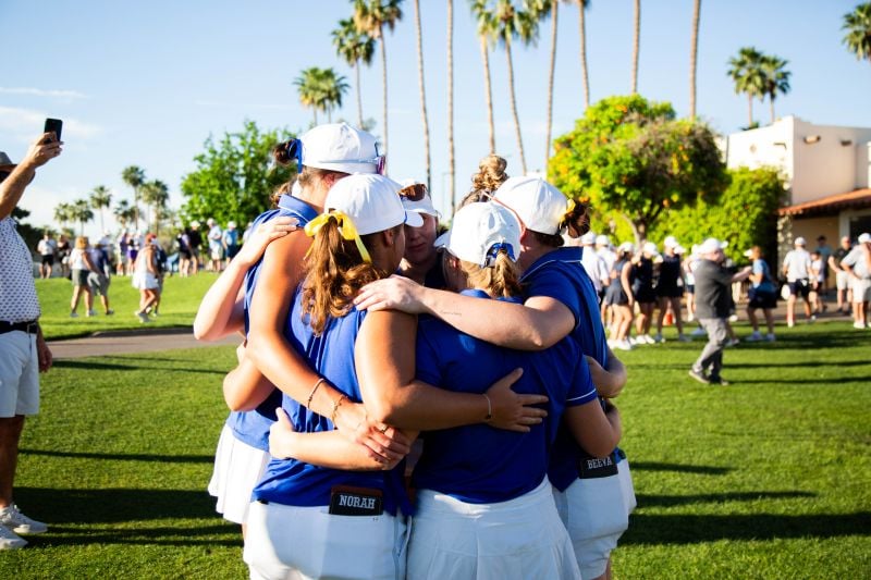 Golfers huddling