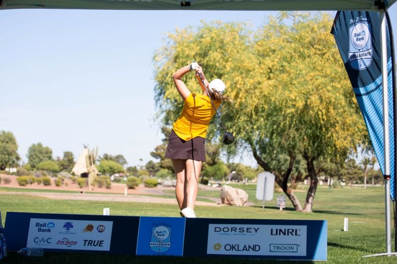 Event sponsor logos with golfer swinging golf club in the background