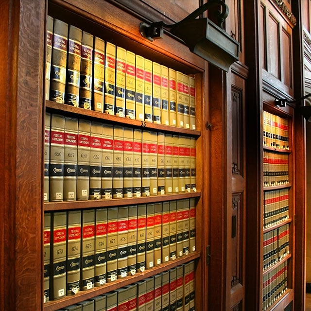 Bookshelves filled with books in a library 