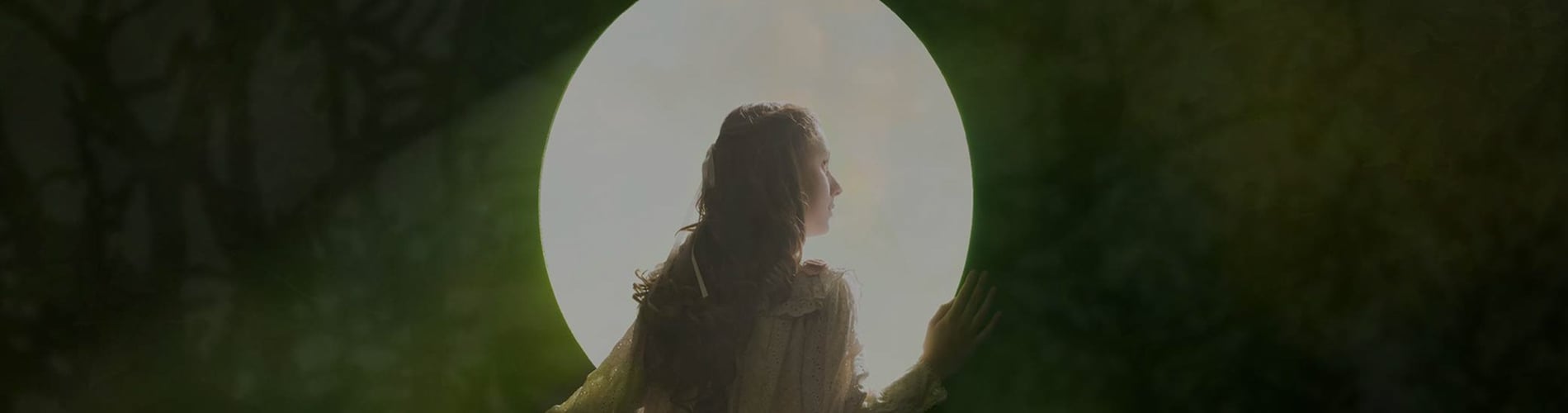 Girl looking through hole