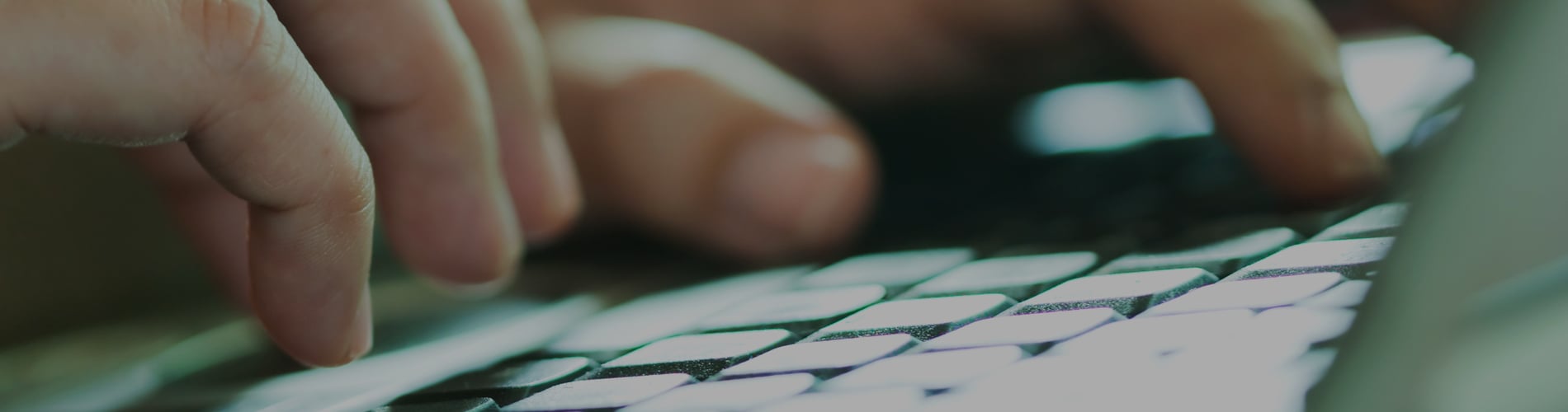 Hands typing on keyboard