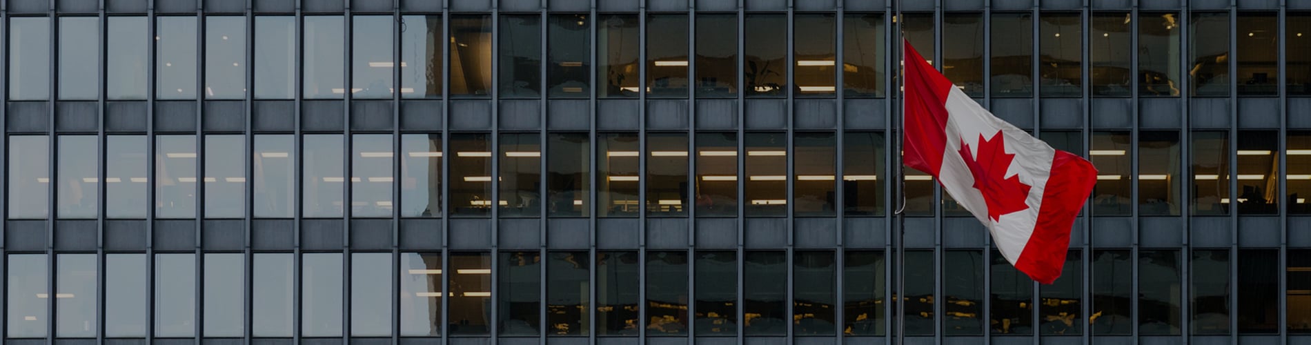 Canadian flag against building