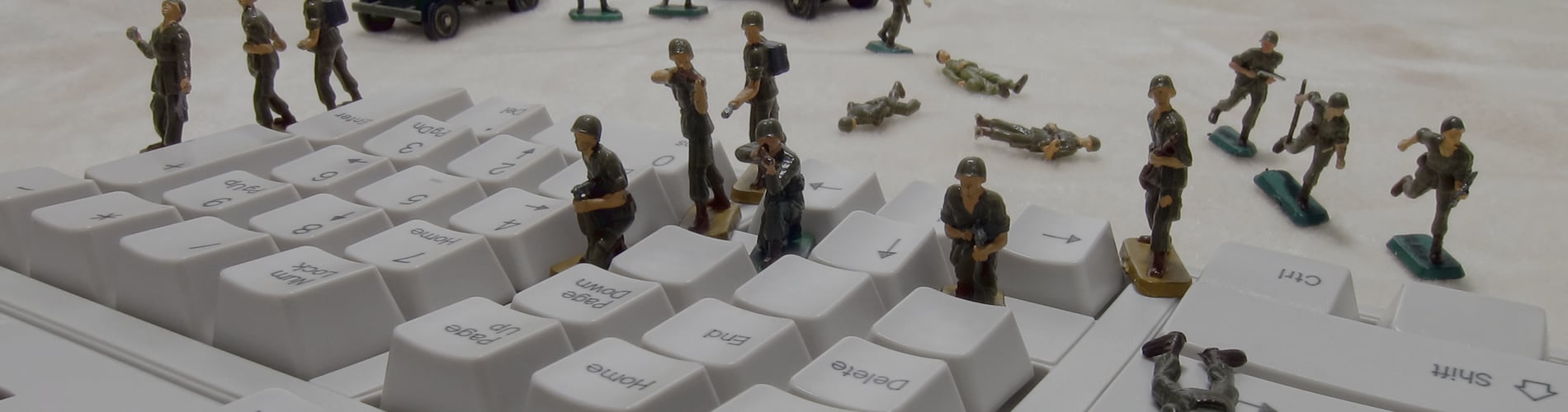 Mini army men on keyboard