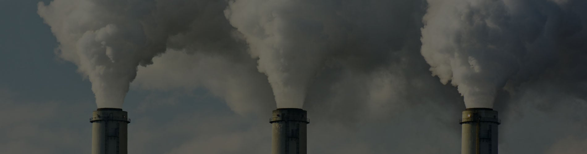 Multiple Coal Fossil Fuel Power Plant Smokestacks