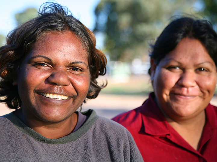 An image of two First Nations women smiling