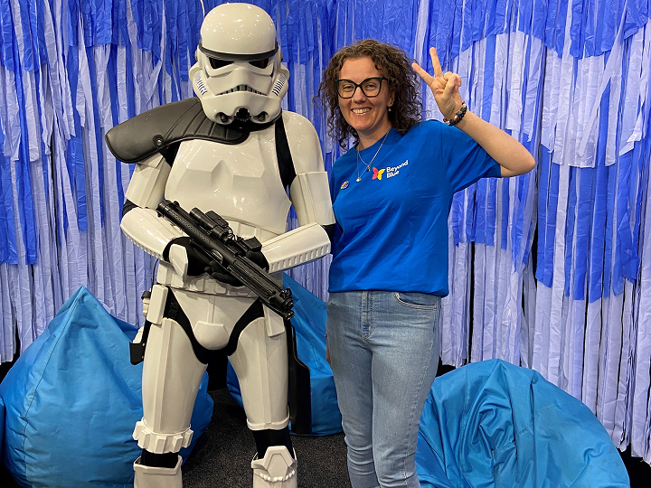 Beyond Blue volunteer at Comic Com stands beside a Star Wars stormtrooper