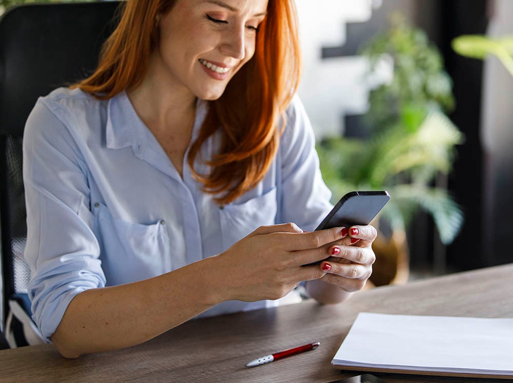 Patient scheduling an appointment on her phone