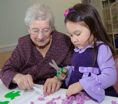 Older woman and young girl doing crafts