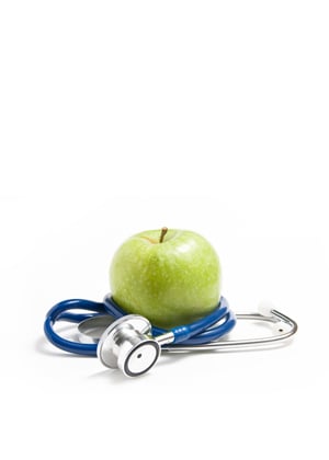 Green apple with stethescope