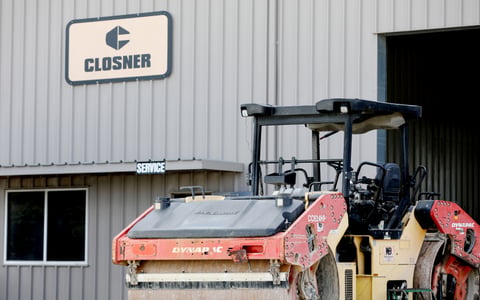 Closner equipment in front of the main office building.