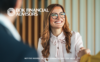 Financial advisor shaking hands with customer.