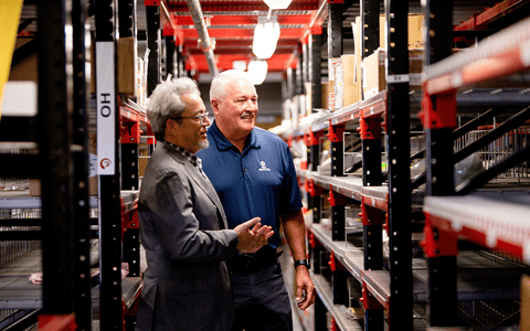 Aero-Zone founder and CEO, Alfredo Dreyfus shows BOK Financial advisor Mike Carney a section of their inventory.