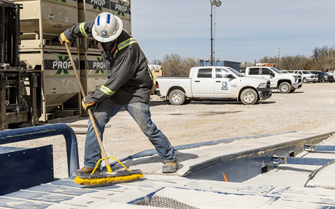 Lobo Logistics co-worker cleaning up.