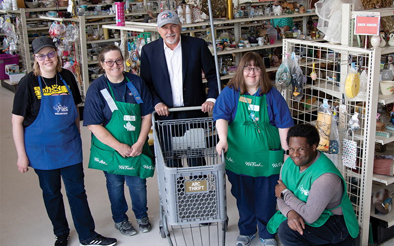 arc Thrift Store CEO and employees smiling about being customers and partners with BOK Financial.