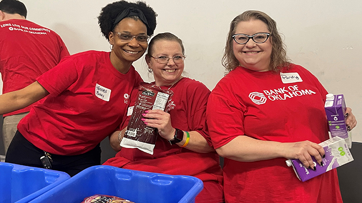 Bank of Oklahoma volunteers helping at a food bank.