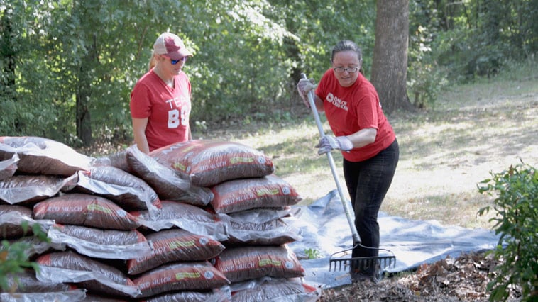 BOK Financial employees participate in hands-on volunteer activities.