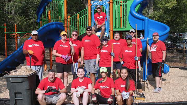 Volunteer workers helping clean up park as part of BOK Financial’s commitment to community service.