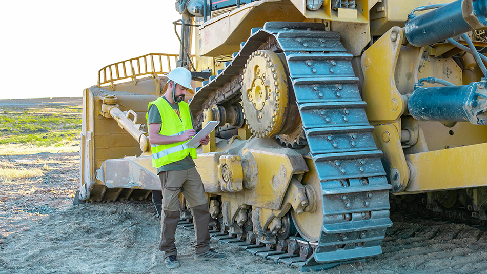 Construction worker with heavy equipment