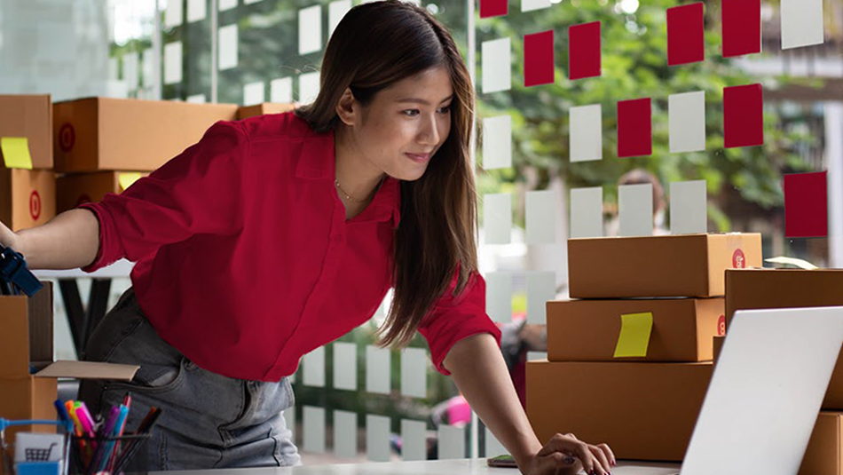 Woman reviewing her laptop for online orders. 