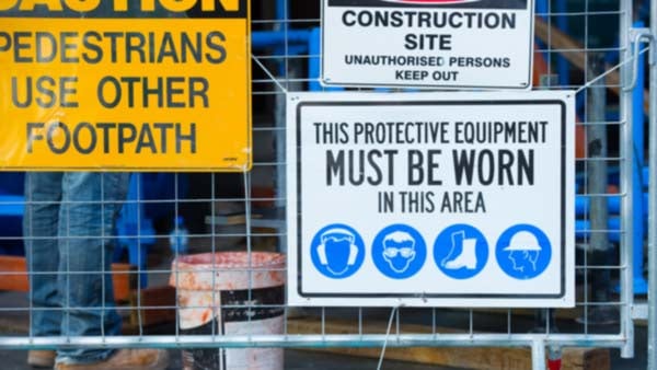 Safety and security signage on a construction site.