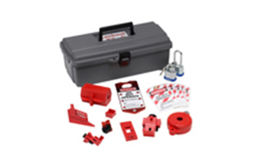 A LOTO kit with contents sitting in front of box.