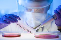 Lab technician with pipette